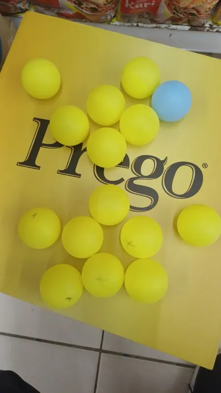A Prego-branded board with table tennis balls set out for a promotion game.